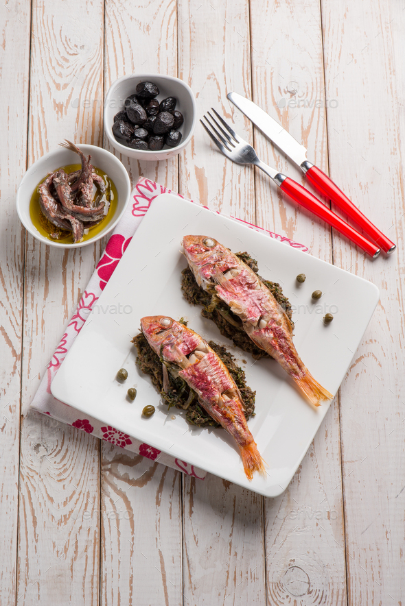 red mullet with sauteed endive capers and black olives Stock Photo by ...